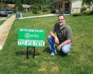 Happy solar client at their Middlesex County, NJ home after installing solar panels with Green Sun Energy Services